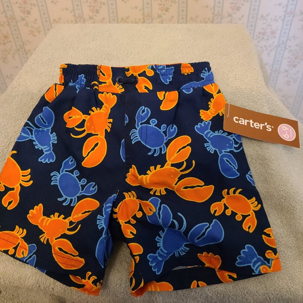 CARTERS LITTLE BOYS SWIM TRUNKS FOR 6 TO 9 MONTHS